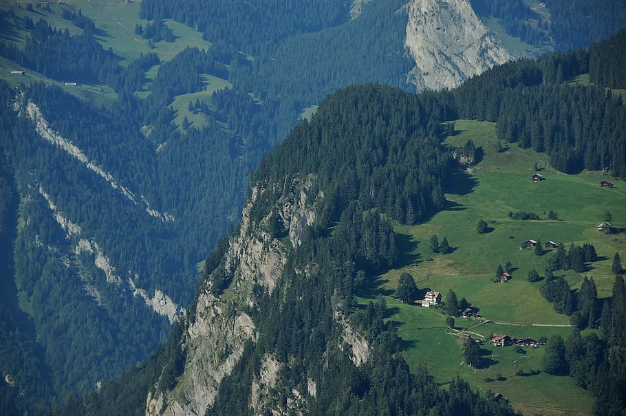 aerial view of mountain cliff during daytime, aerial photography of houses on top of mountain cliff HD wallpaper