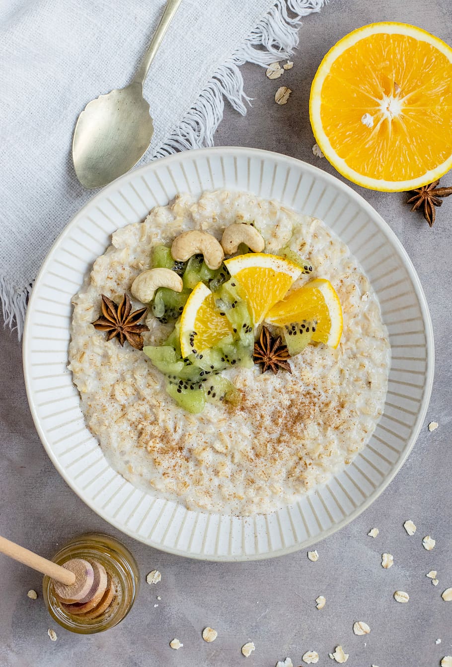 sliced fruit and kiwi on plate, white ceramic bowl filled with oatmeal and sliced orange on top, HD wallpaper