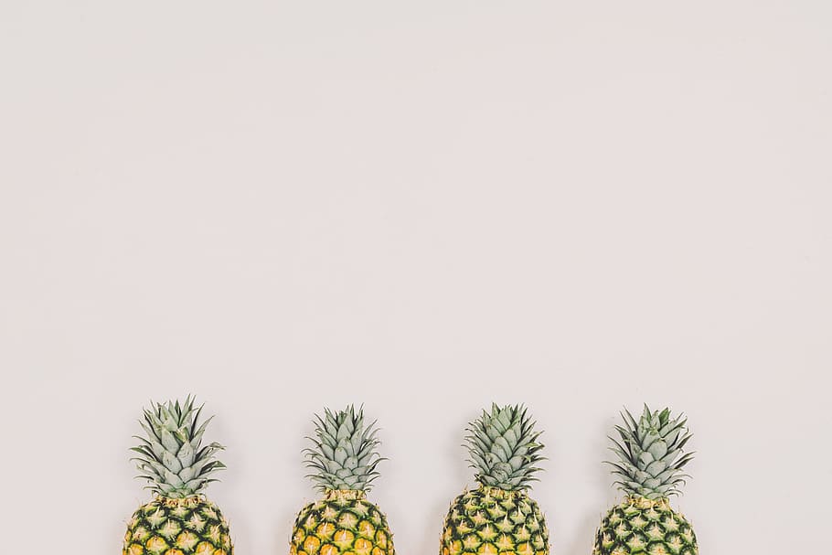four pineapples on white background, four yellow pineapples near wall HD wallpaper