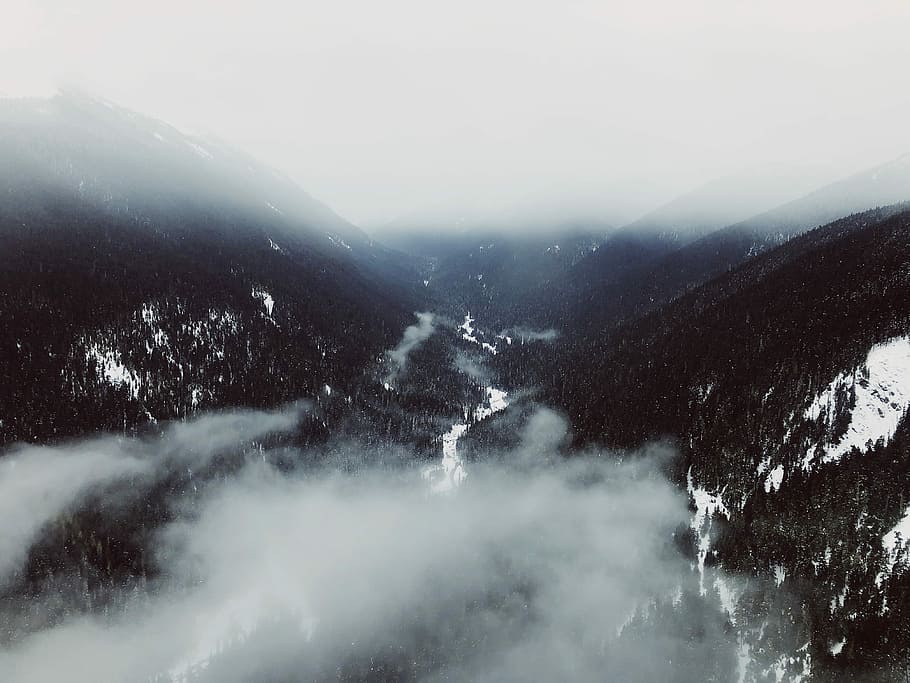 aerial photography of mountain range covered with fogs, birds eye view of mountain covered with smoke HD wallpaper