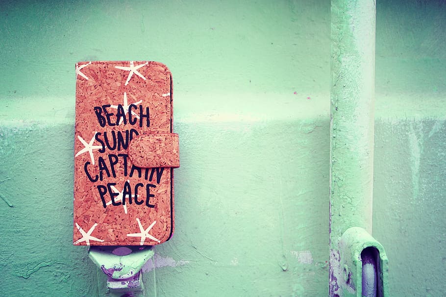 red and black beach sund captain peace smartphone flip case, sign HD wallpaper