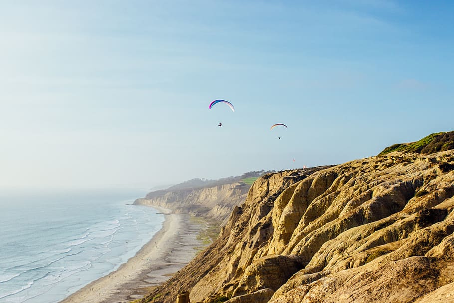 two person doing paragliding during daytime, coast, parasail, HD wallpaper
