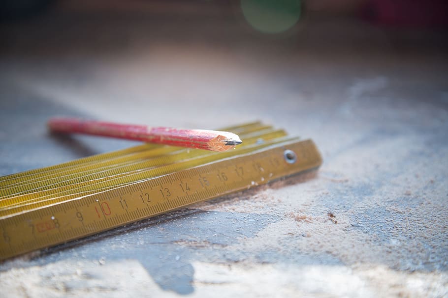 selective focus photography of red pencil on carpenter's ruler HD wallpaper
