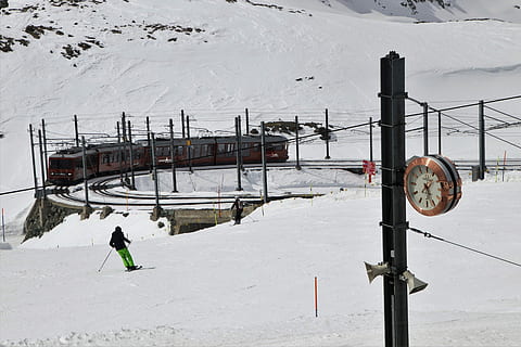man playing snow skis near train railway, zermatt, winter, cold HD wallpaper