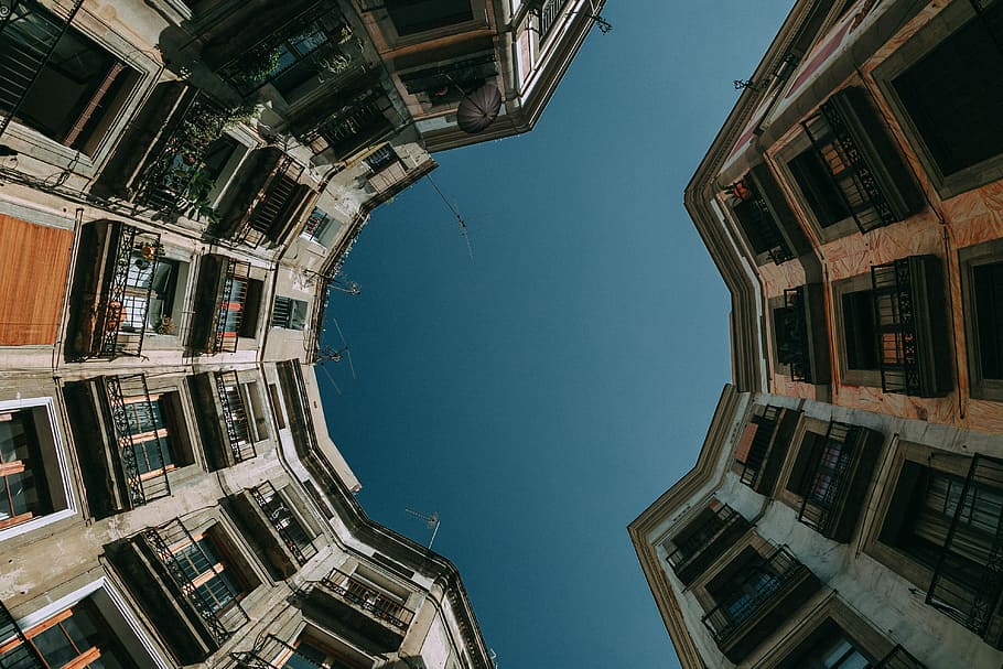 condominiums during daytime, low angle view of high-rise building HD wallpaper