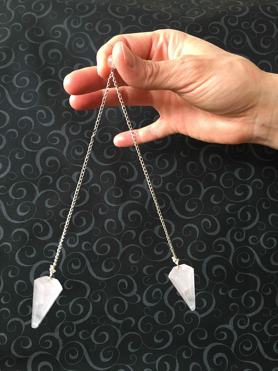 person holding silver jewelry, pendulum, hypnosis, hypnotist HD wallpaper