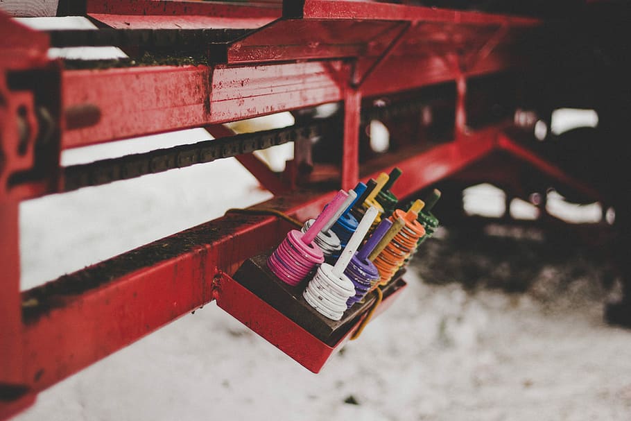 closeup photo of assorted-color metal vehicle part, beads arranged on rack selective focus photography HD wallpaper