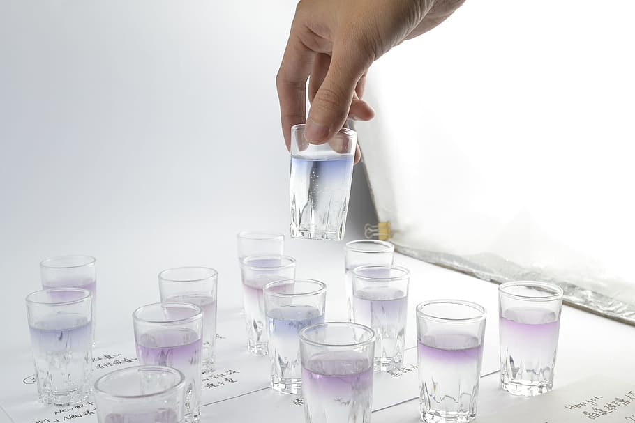 person holding drinking glass filled with liquid, testing, experiment HD wallpaper