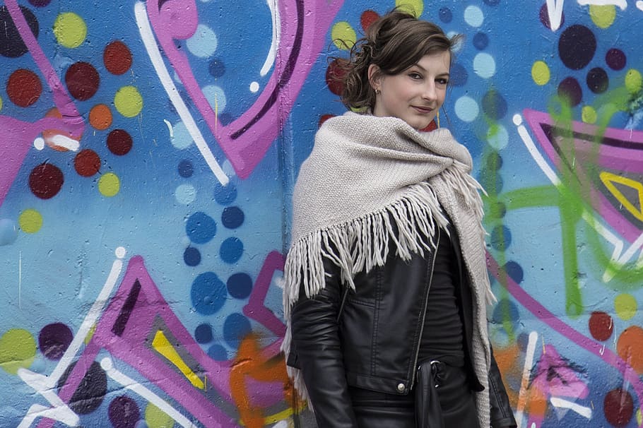 woman wearing black leather jacket and brown scarf, Graffiti