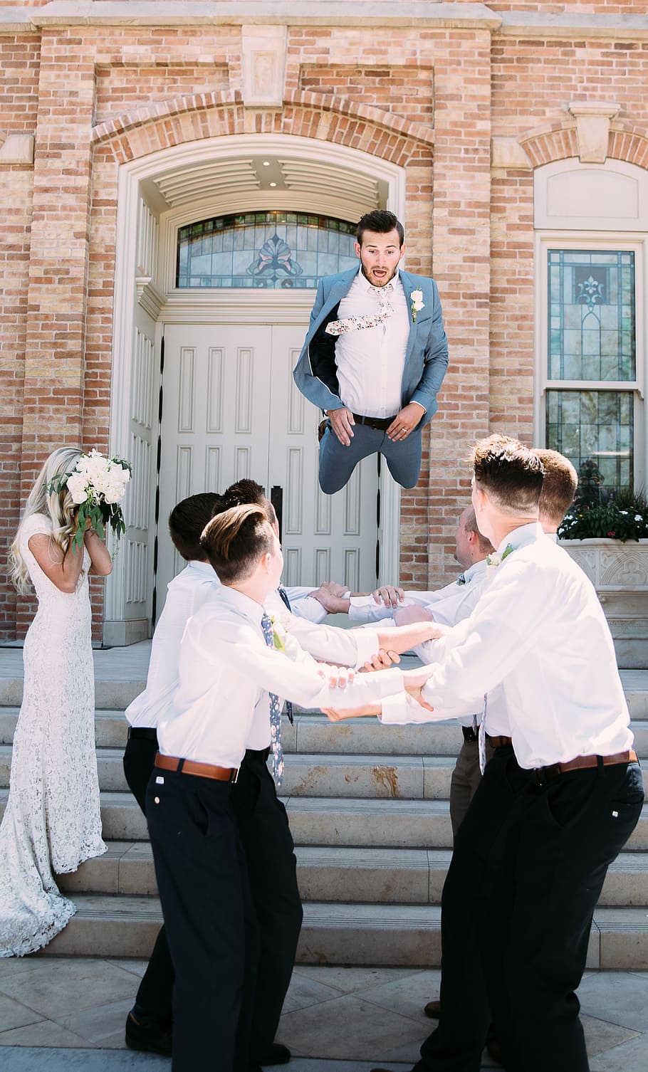 man jumping in front of mans, people, men, fall, play, wedding HD wallpaper