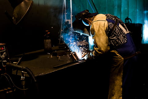 man welding black metal, welder, work, machine, technology HD wallpaper