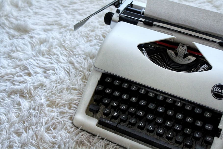 white and black typewriter on white textile, closeup photo of white and black typewriter HD wallpaper