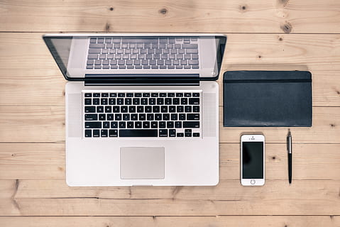 MacBook Pro, silver iPhone 6, and black retractable pen, desk HD wallpaper