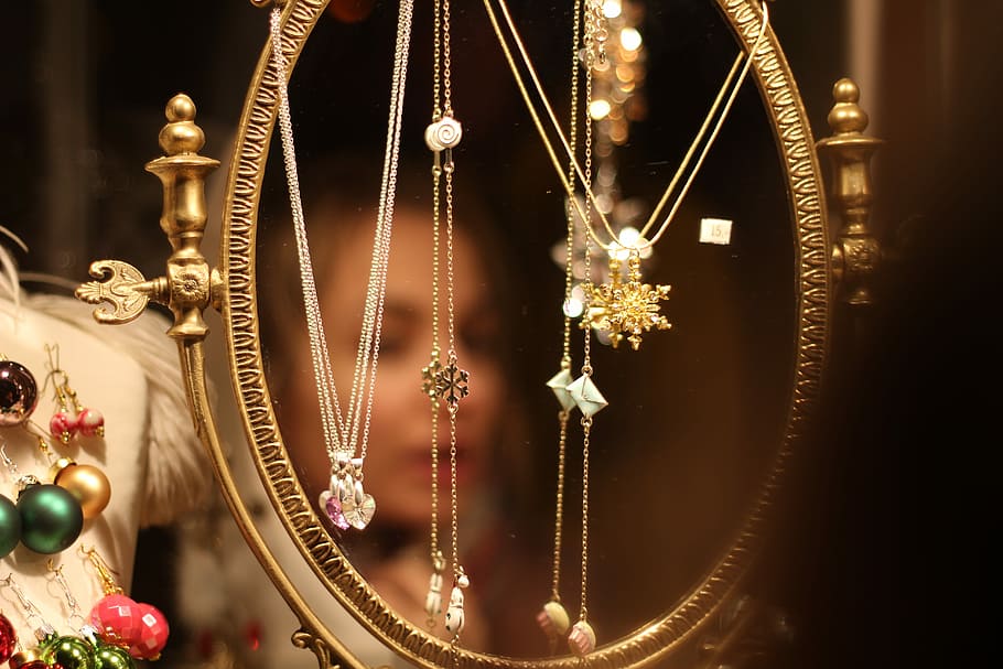 assorted jewelries hanged on mirror, round gold-colored framed mirror with hanged assorted pendant necklaces, HD wallpaper