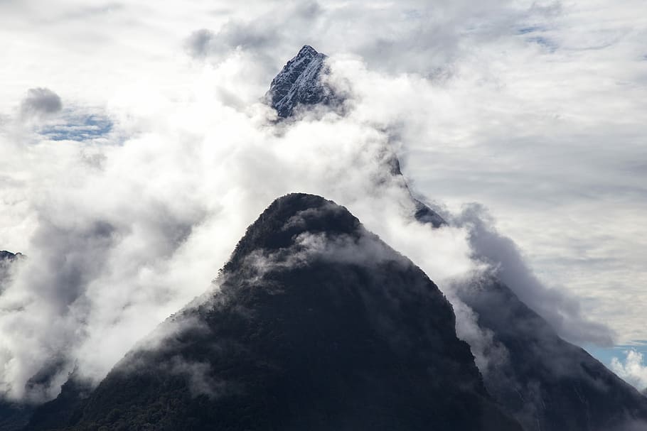 aerial photography of mountain covered with fogs, close-up photography of ice-capped mountain HD wallpaper