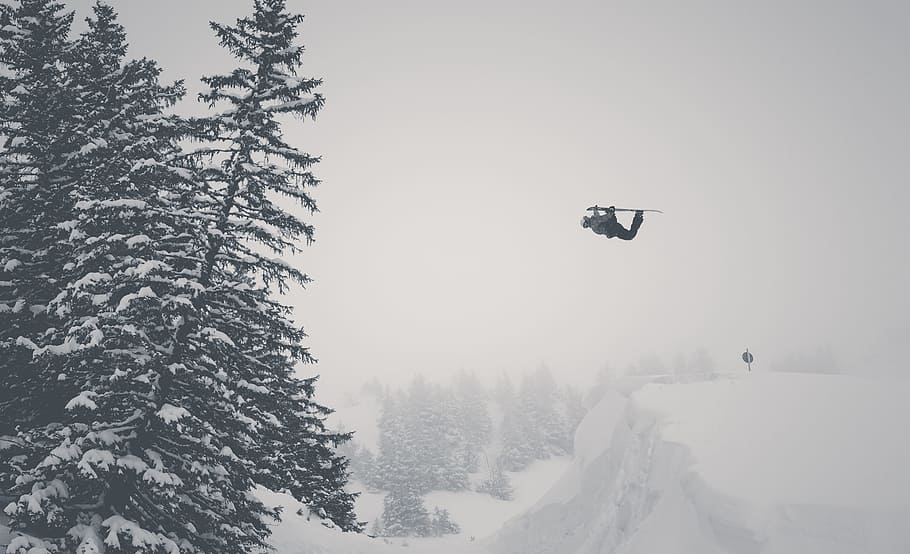man jump on snow mountain using ski blades, black helicopter under the sky HD wallpaper