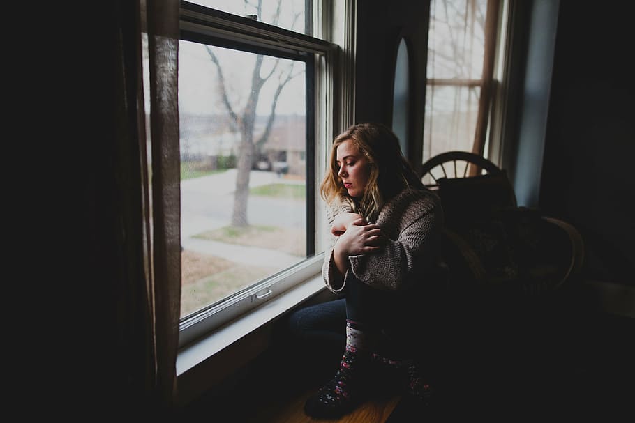 woman near window watching outside photography, gray, jacket