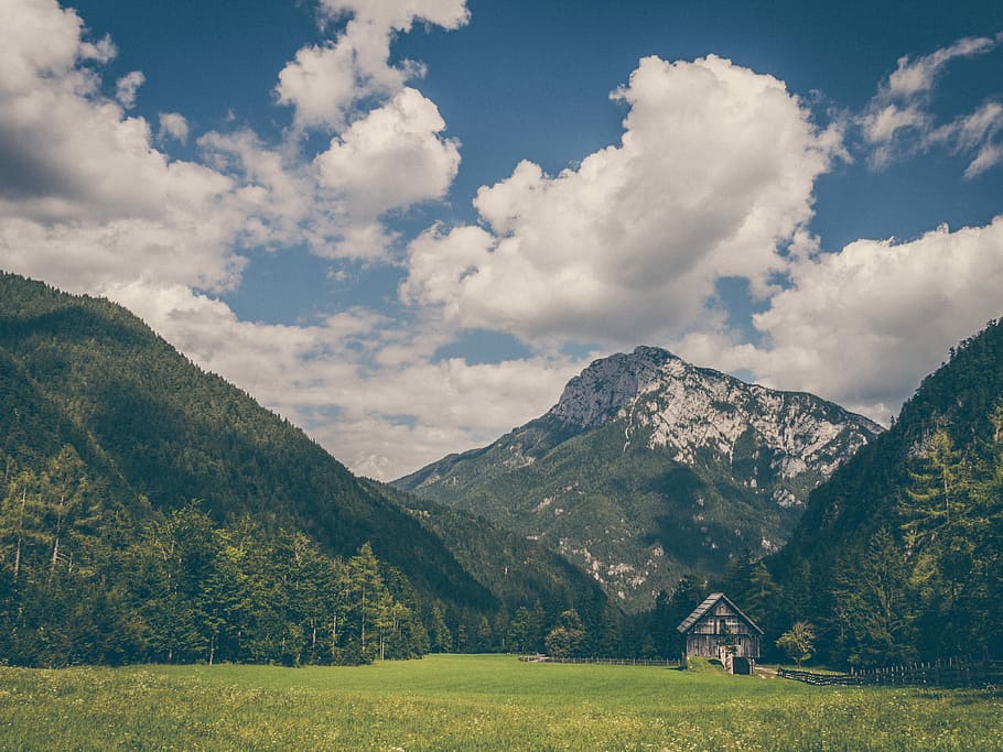 house near mountain, brown wooden house between mountains and forest HD wallpaper