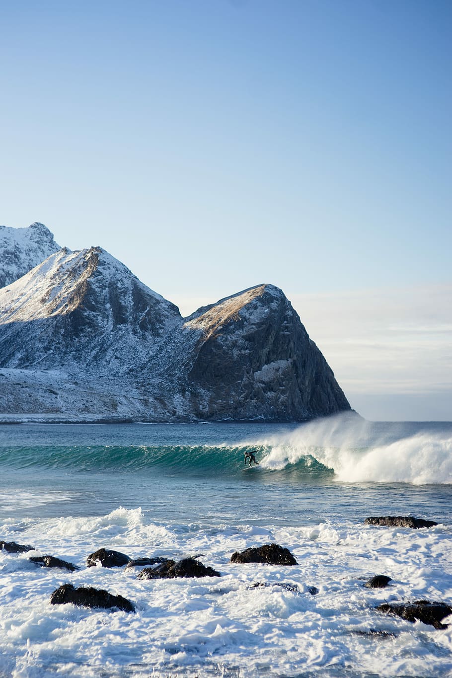 surfer riding body of water wave during daytime, person surfing on waves under blue sky during daytime HD wallpaper