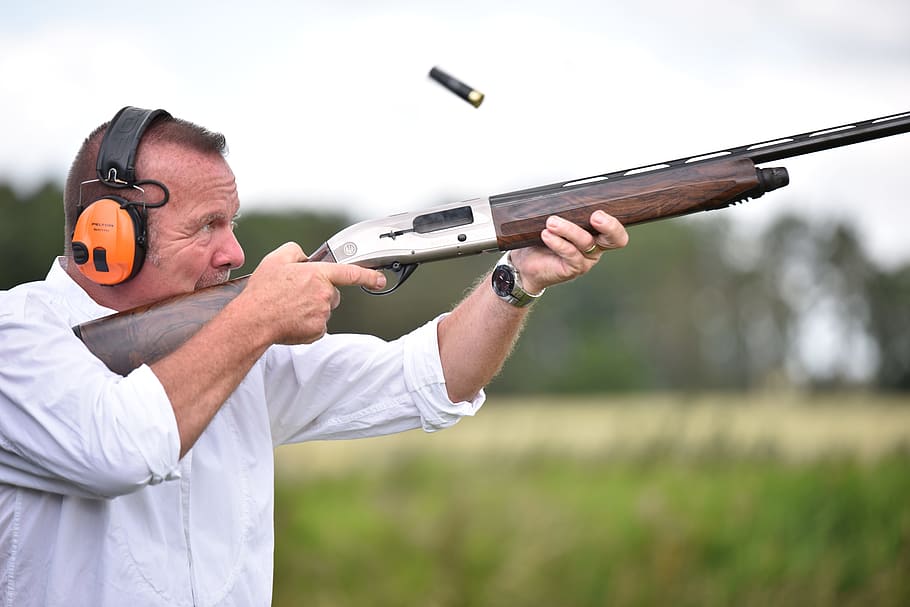 man using his brown hunting rifle, shooting, headphones, sports, HD wallpaper