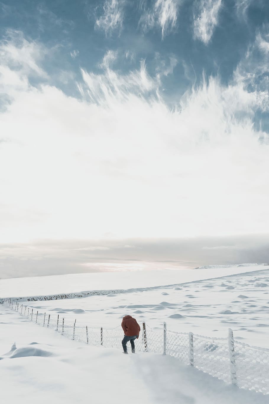 man beside white fence on snowfield, person beside fence on snow-covered field HD wallpaper