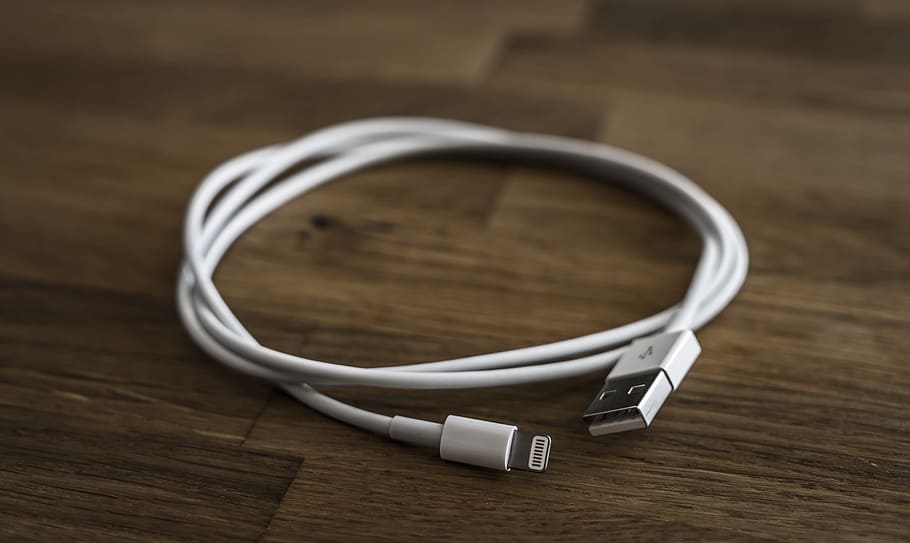 white 8-pin lightning cable on brown wooden board, Usb, Computer