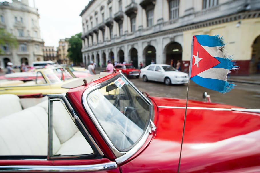 red convertible car with flag on the street, cuba, old, havana HD wallpaper