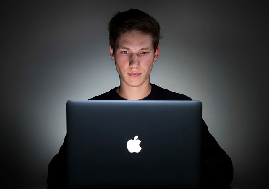 man in front of opened MacBook, apple, logo, laptop, male, portrait HD wallpaper