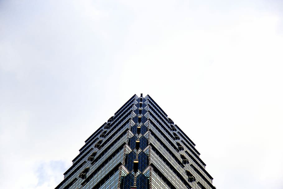 low-angle photography of black high-rise building during daytime, low angle photo of gray concrete building during daytime HD wallpaper