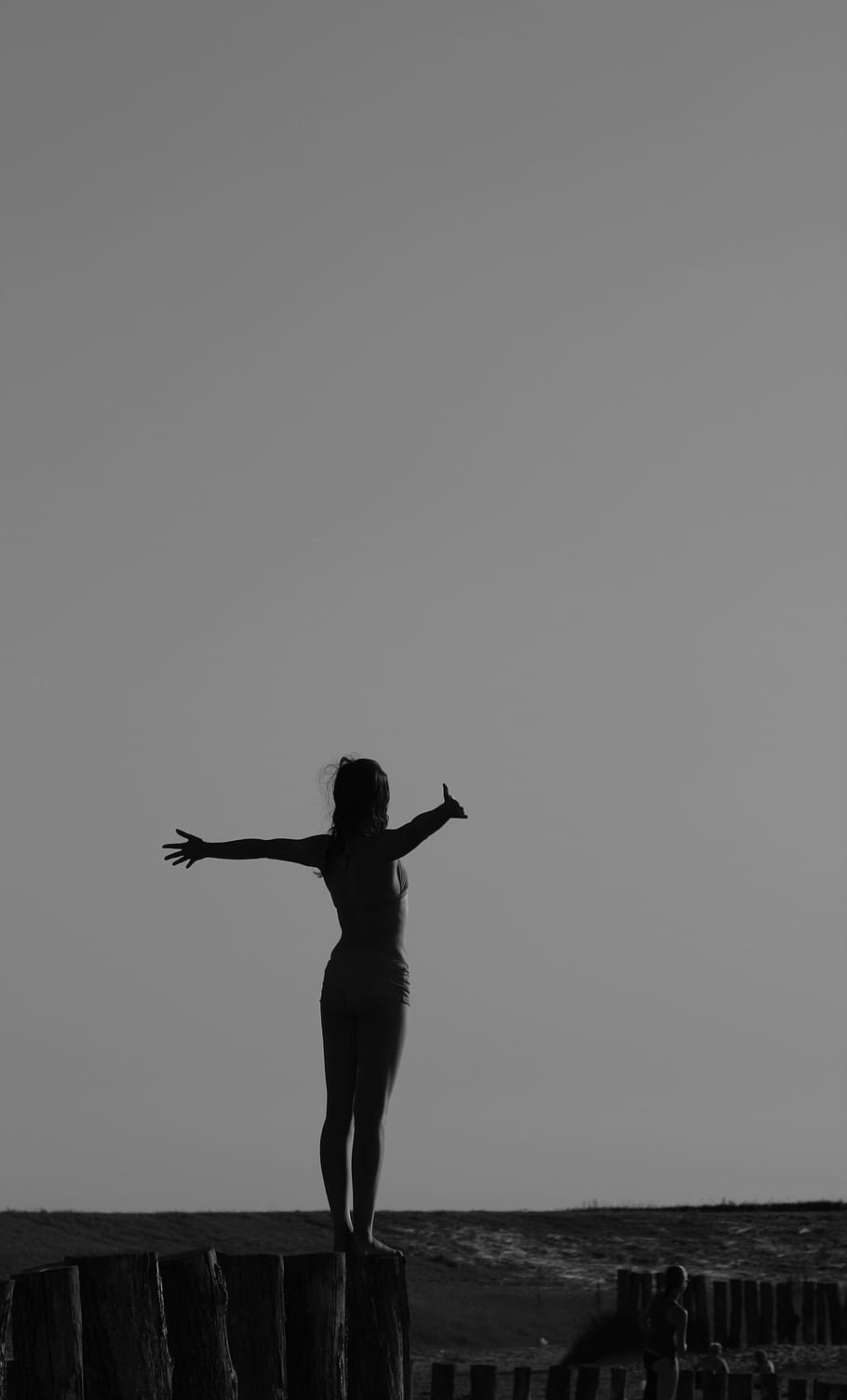 woman spreading her arms near beach, silhouette, daytime, yoga