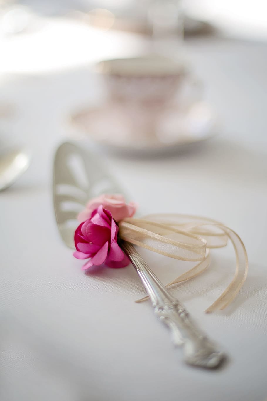 selective focus photo of stainless steel utensil with flower-accent HD wallpaper