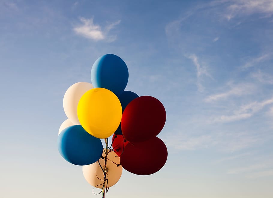 low-angle photography of assorted-color balloons under blue sky during daytime HD wallpaper