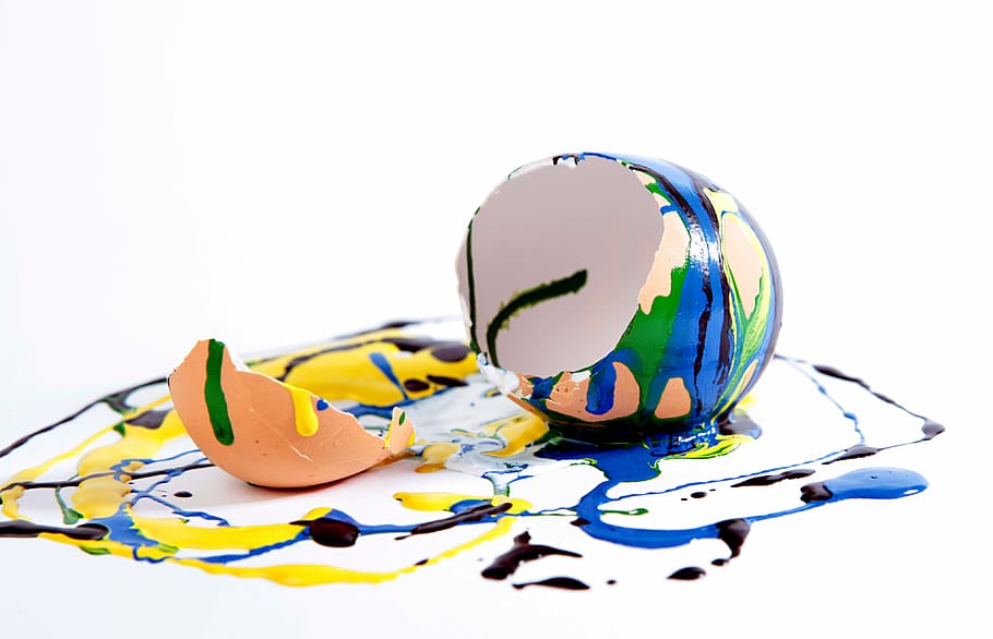 assorted-color cracked egg on white and multicolored surface HD wallpaper