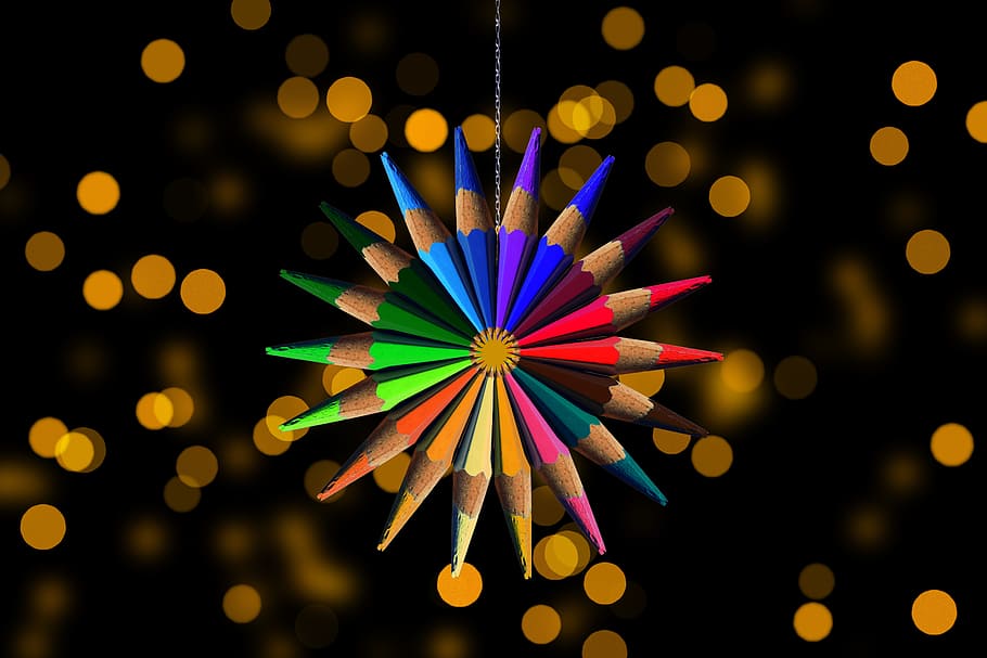 selective focus photography of colored pencil hanging decoration
