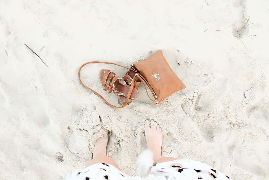 pair of brown leather sandals, brown leather crossbody bag beside leather slippers HD wallpaper