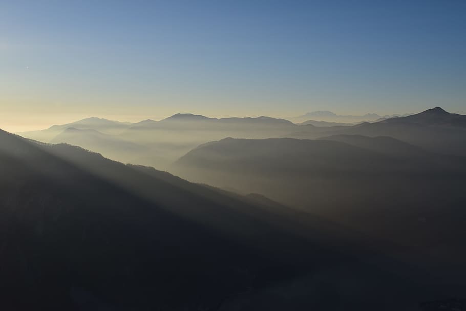 gray mountain at daytime, view of mountain top with ray of sun HD wallpaper