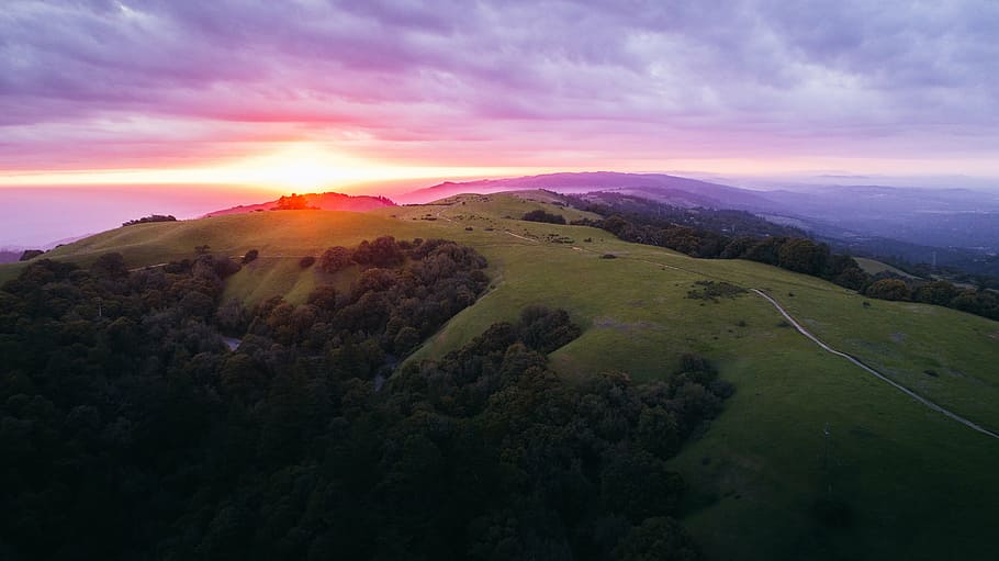 aerial photo of hills with green trees during golden hour, clouds HD wallpaper