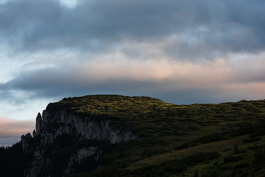 hill, highland, dark, sunset, grass, nature, landscape, clouds HD wallpaper