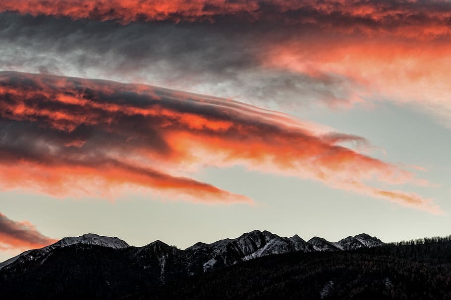 selective color photography of clouds, silhouette photo of mountain during golden hour HD wallpaper