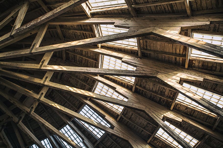 Architectural details from the roof of a wooden building at Chatham Historic Dockyard in Kent, England HD wallpaper