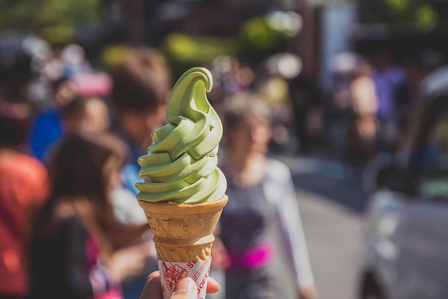 Yummy Green Sweet Treat, person holding ice cream on cone, green ice cream