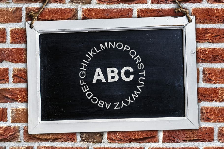 alphabet letters on blackboard with white frame, abc, literacy