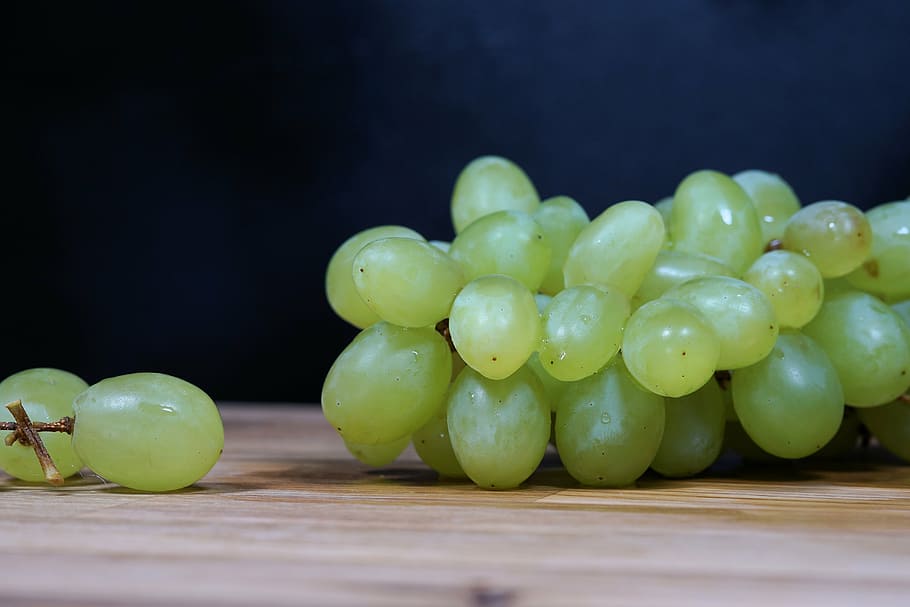 bunch of chardonnay on brown wooden surface closeup photography HD wallpaper