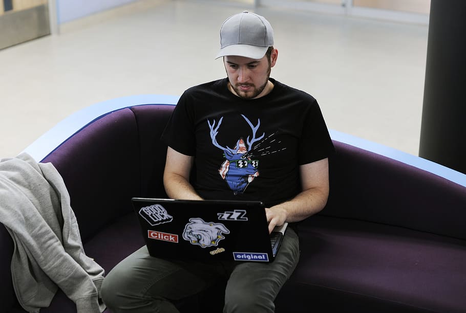 man, person, laptop, working, adult, alone, cap, computer, device HD wallpaper
