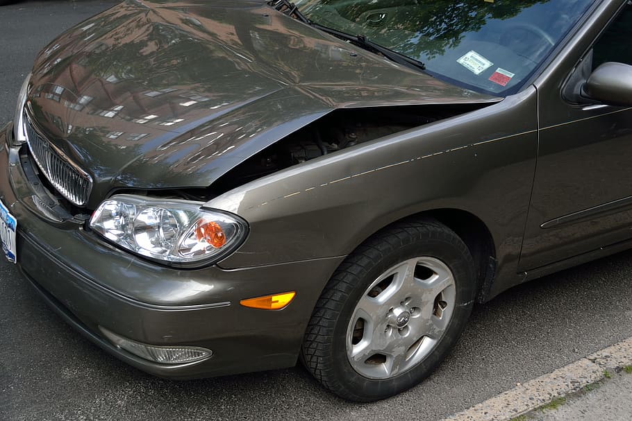 grey vehicle with bent hood, crashed car, damage, dent, accident