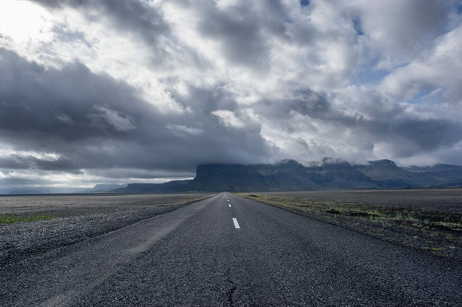 concrete road under cumulunimbus clouds, gray asphalt road, mountain HD wallpaper