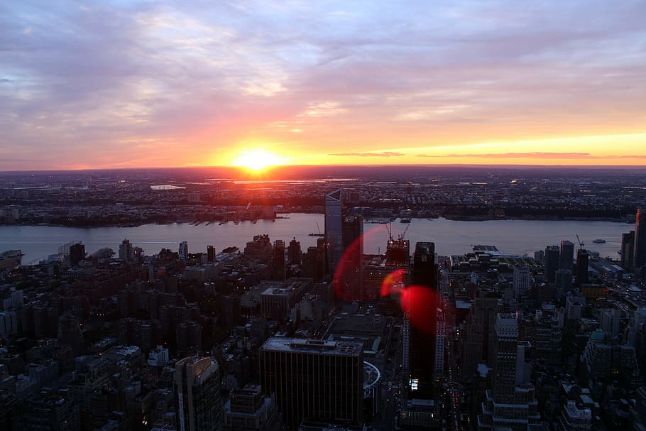 silhouette aerial photography of buildings and body of water HD wallpaper
