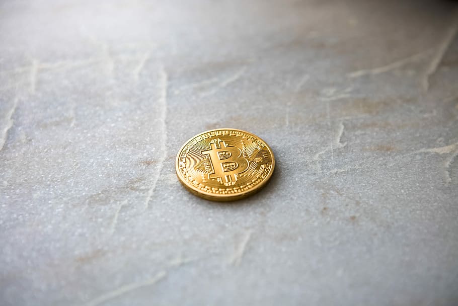 gold Bitcoin, closeup photo of Bitcoin coin on surface, cryptocurrency HD wallpaper