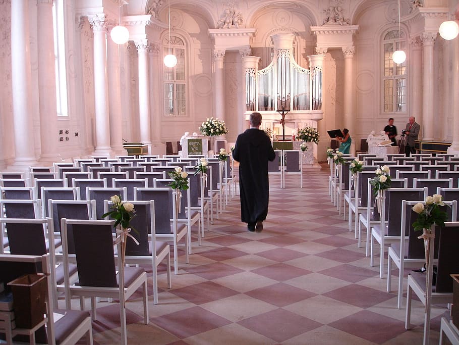 person walking in front of altar, church, pastor, wedding, celebration