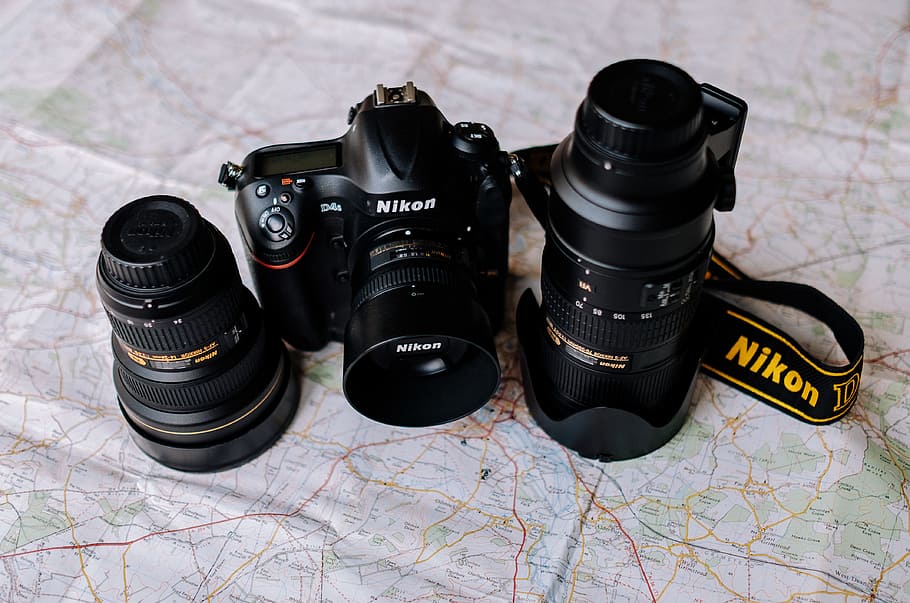 two black Nikon DSLR cmeras and lens, black Nikon DSLR camera with lenses